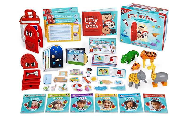 Contents of Behind the Little Red Door Early Literacy Kit including books, animals, and storytelling pieces