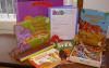 Contents of the Read Early Literacy Kit including books, magnets, and rhythm sticks